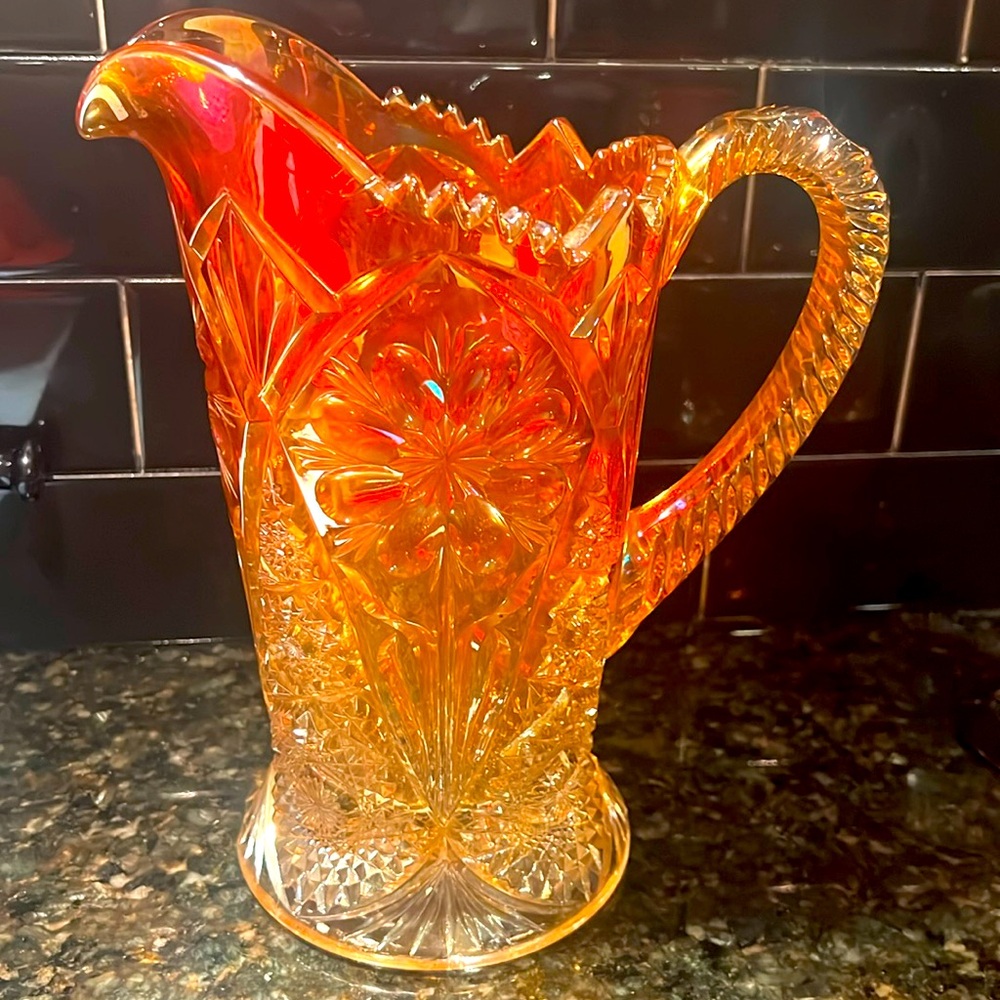 Vintage orange crystal pitcher, has a tiny chip in the base